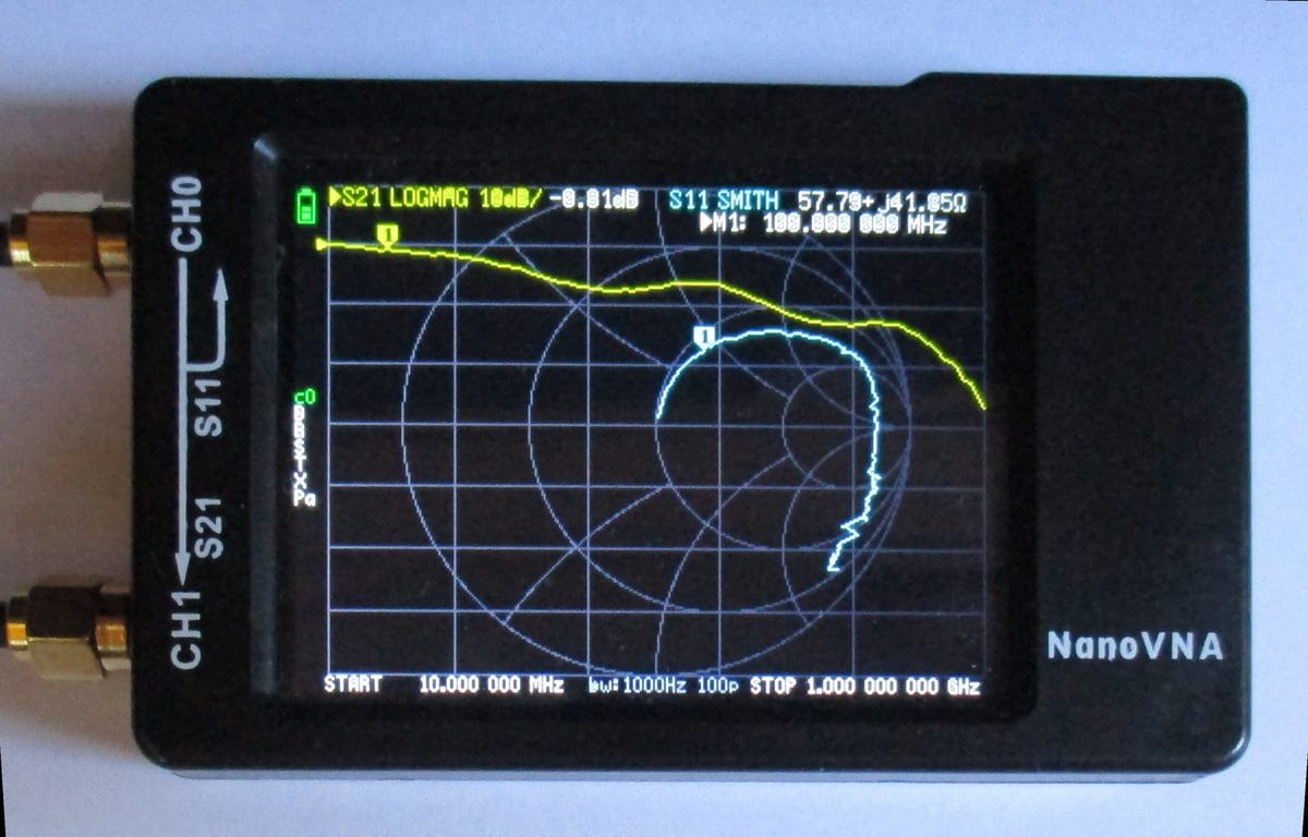 NanoVNA display showing S11 Smith chart and S21 log magnitude measurement