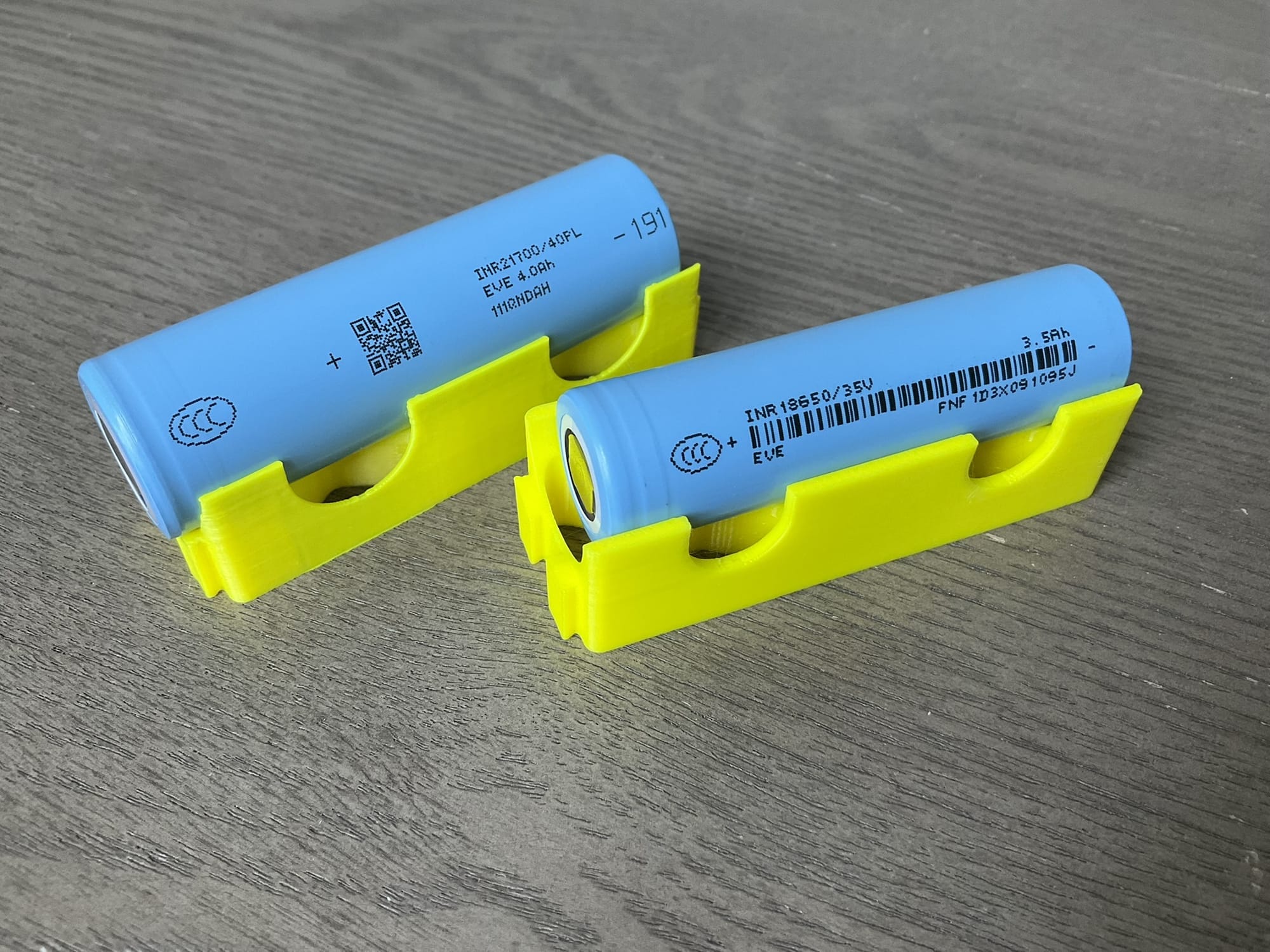 Two 18650 lithium cells in 3D-printed holders — the standard battery configuration for solar Meshtastic nodes.