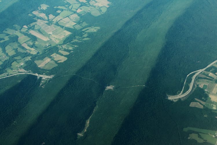 Aerial view of Blue Mountain and Kittatinny Ridge in Pennsylvania showing the ridge-and-valley terrain that defines RF propagation across NEPA